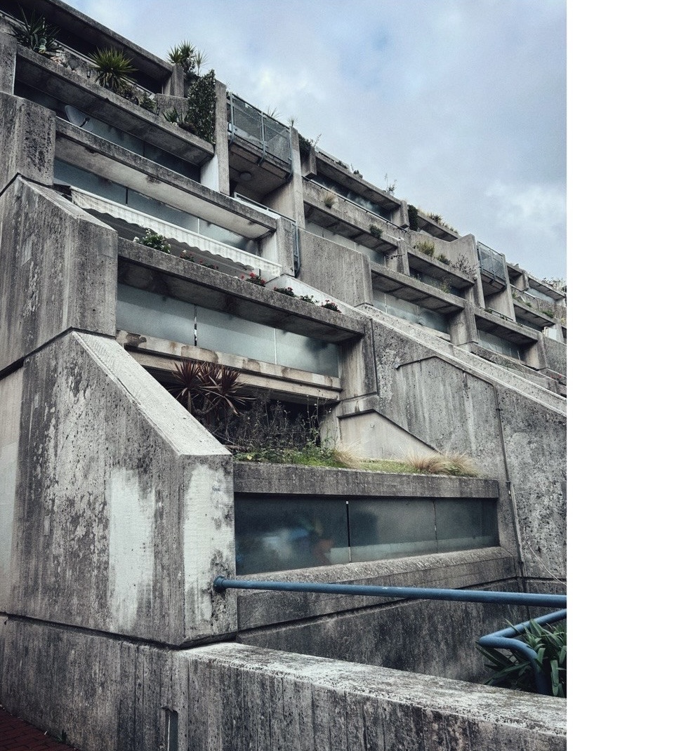 Brutalist housing terraces with blue railings